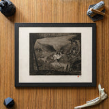 A framed black and white Danse Macabre art print depicting a fantasy scene, styled on a wooden surface with decorative Bone objects.
